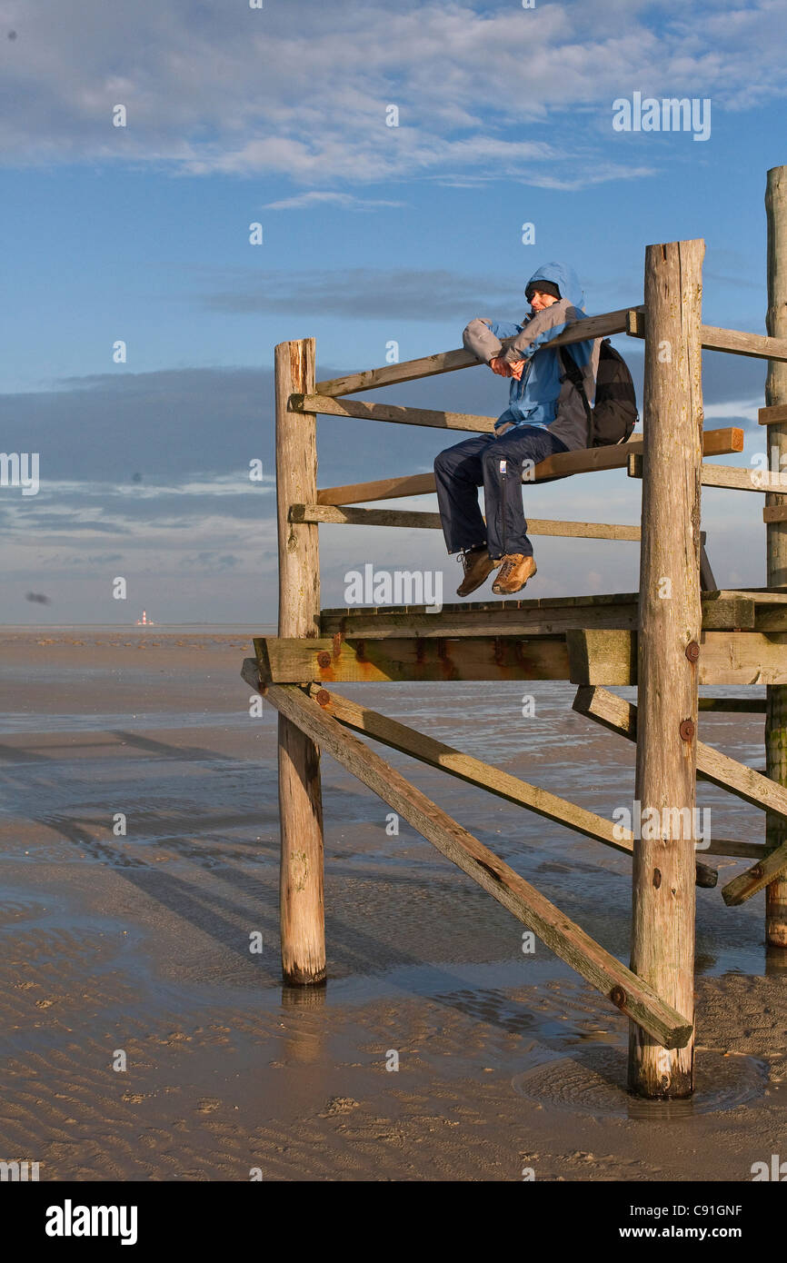 Person on an observation platform at low tide, St Peter-Ording, North Sea, Schleswig-Holstein, northern Germany Stock Photo
