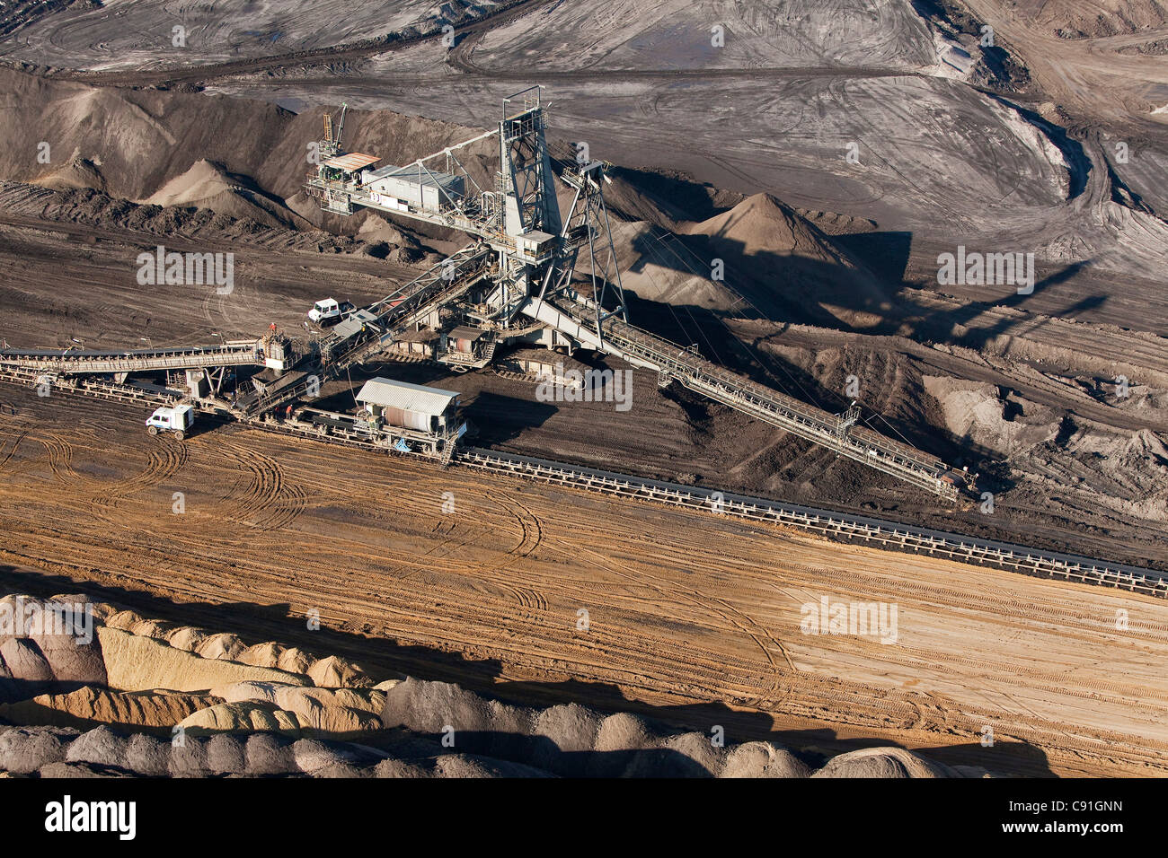 Aerial view of a bucket-wheel excavator with conveyor belt in for open-pit lignite mining brown coal Schoeningen Lower Saxony Ge Stock Photo