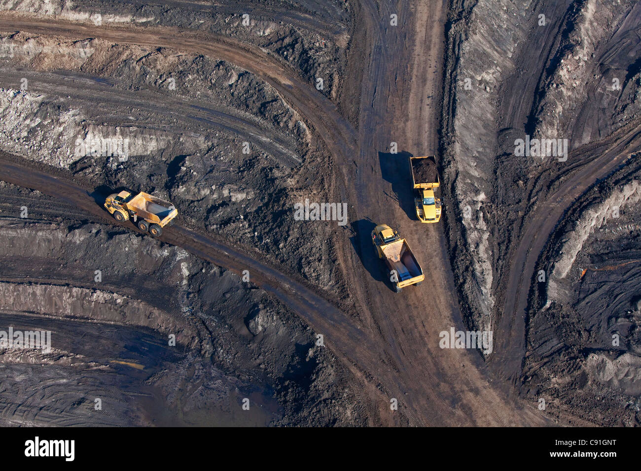 Aerial view of an open-pit lignite mine, Lorries transporting brown coal, Schoeningen, Lower Saxony, Germany Stock Photo