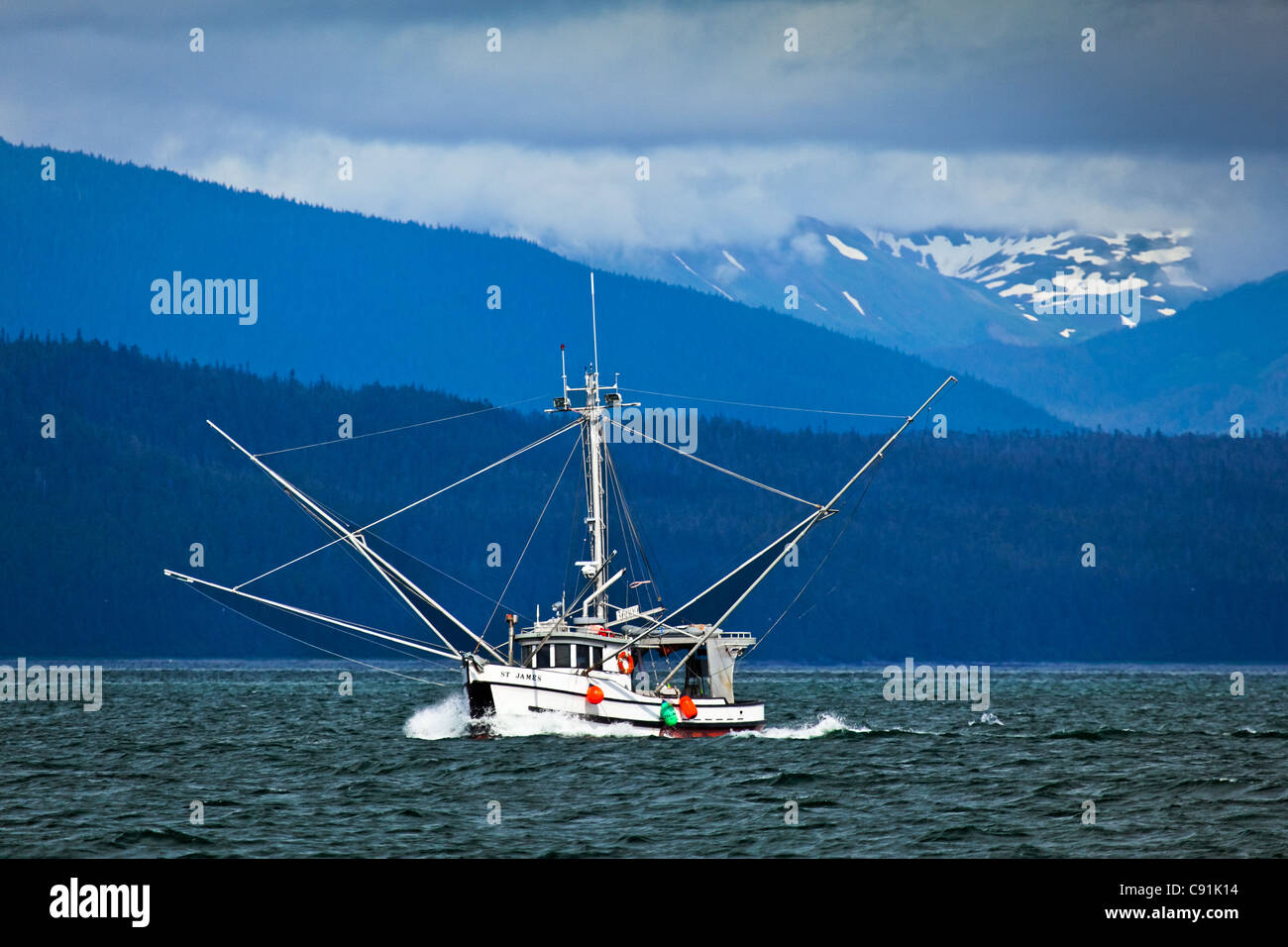 A fishing boat sailing near Chichagof Island, Glacier Bay National Park & Preserve, Southeast Alaska, Summer Stock Photo