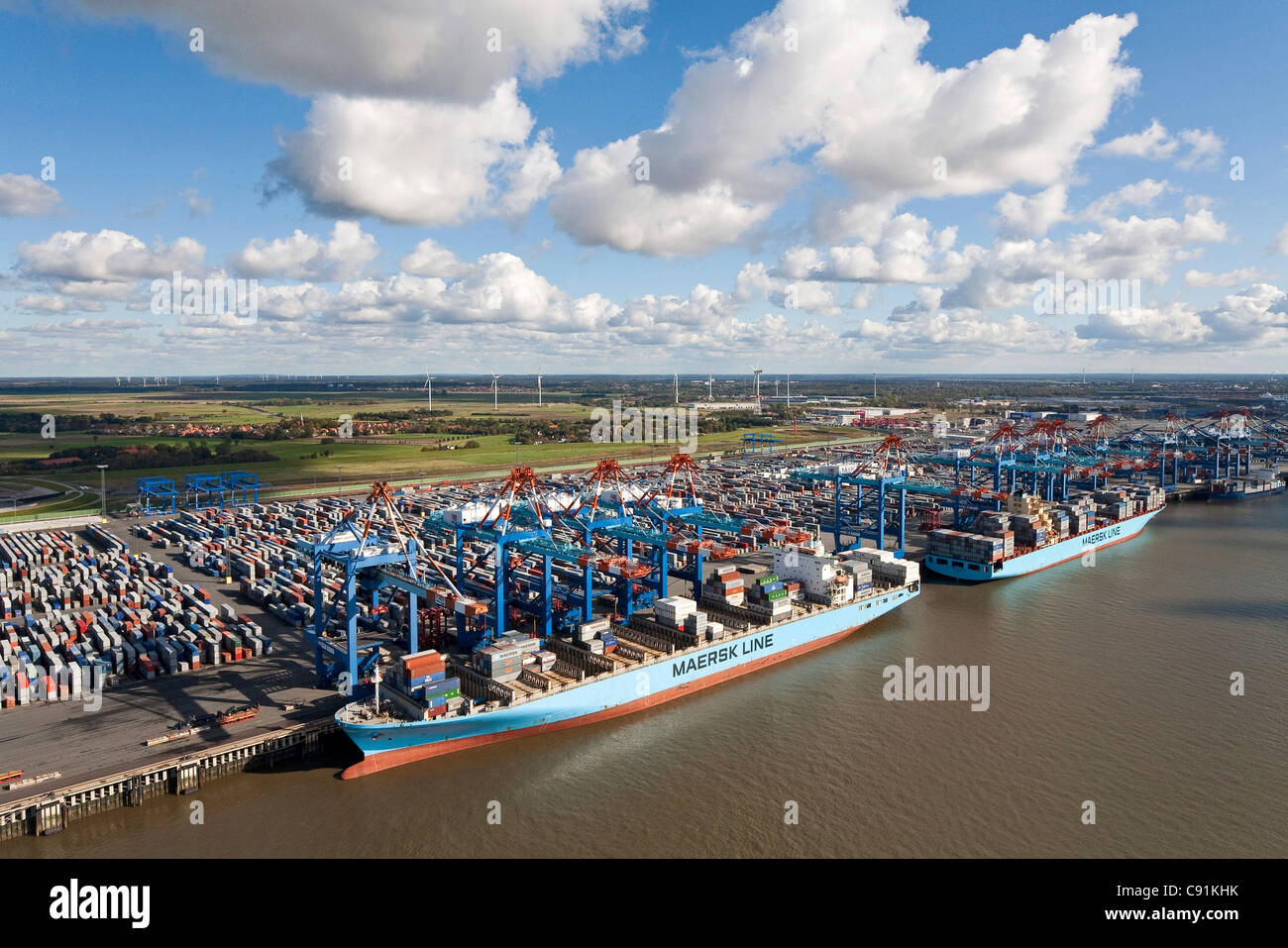 Aerial view of a container port with loading cranes, terminal and ships along the pier, Bremerhaven, Bremen, Germany Stock Photo