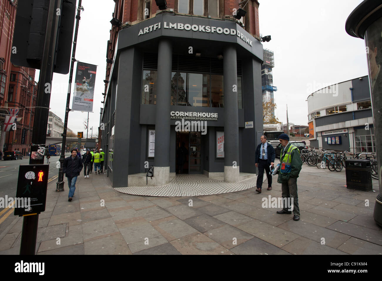 Cornerhouse cinema on Oxford Street Manchester  (now closed) Big Issue seller outside Stock Photo