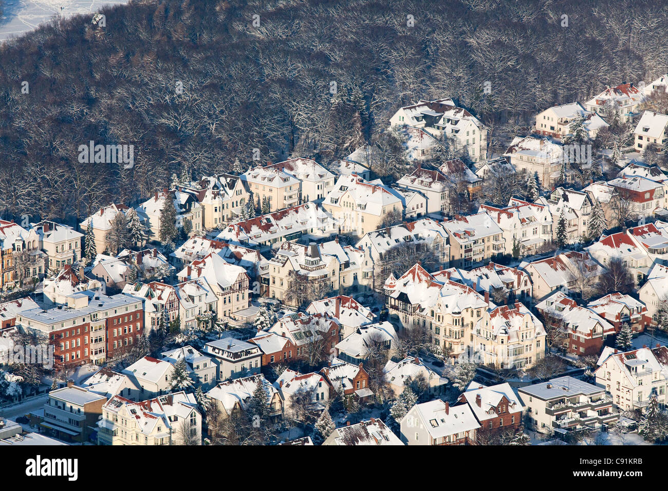 Aerial view of Hannover in the winter snow, city flats on the edge of Eilenriede city forest, Lower Saxony, Germany Stock Photo