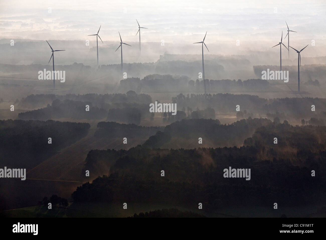 Aerial view of a wind farm in the early morning mist, Lower Saxony, Northern Germany Stock Photo