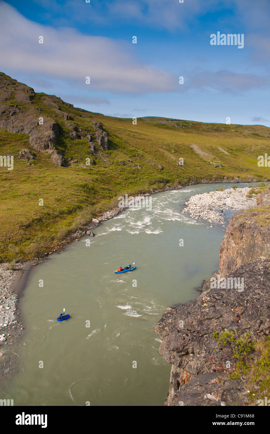 Rafters float down the Hulahula River rapids in a Soar, ANWR, Brooks Range, Summer in Arctic Alaska. Stock Photo