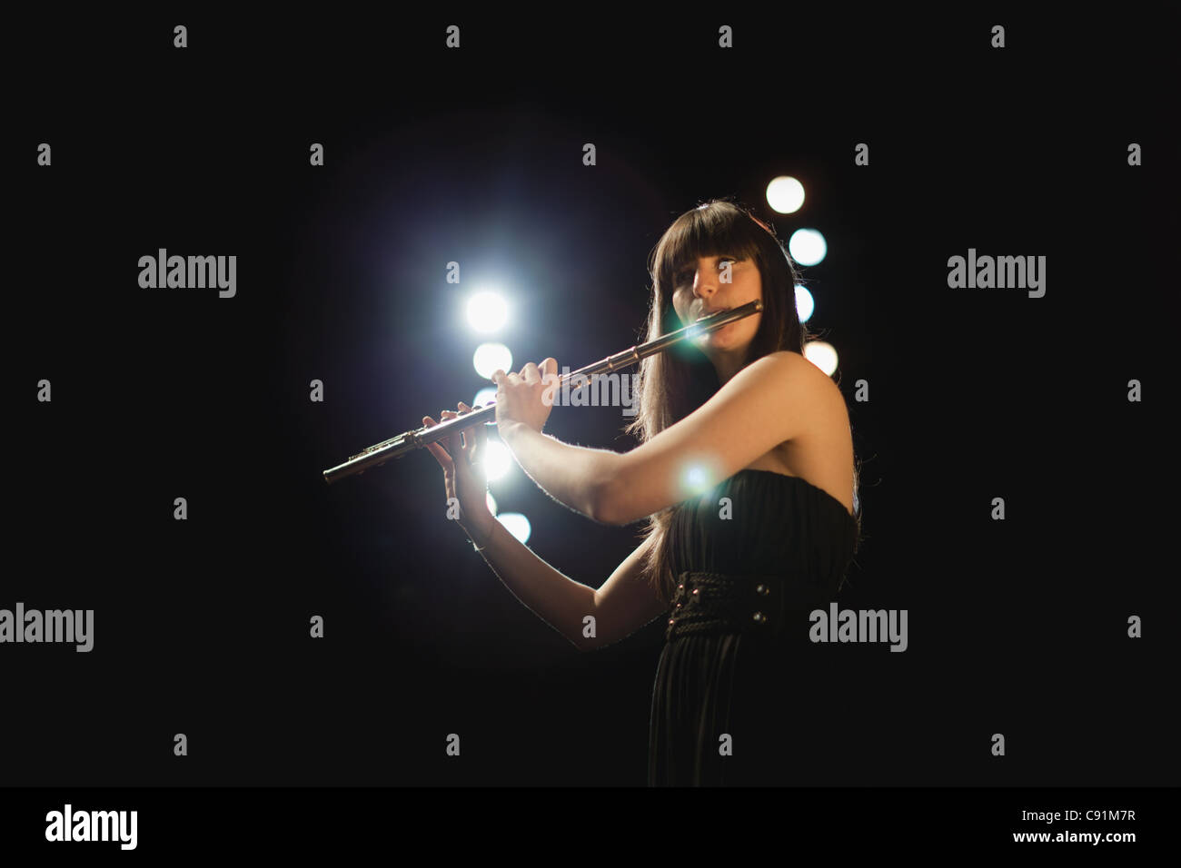 Flute player on stage Stock Photo Alamy