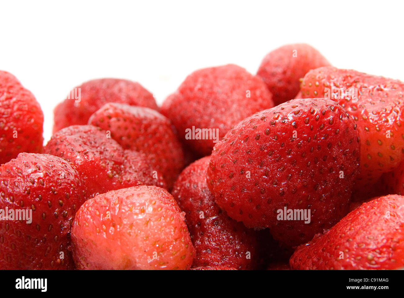 Close-up of ripe strawberry on white background Stock Photo - Alamy