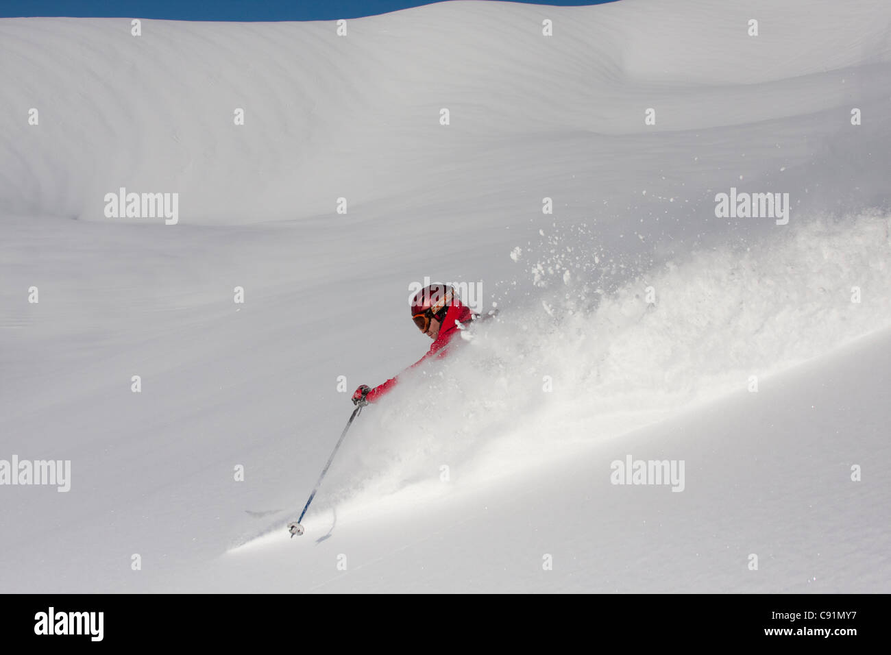 Downhill skier in fresh powder at Alyeska Resort, Southcentral Alaska, Winter Stock Photo