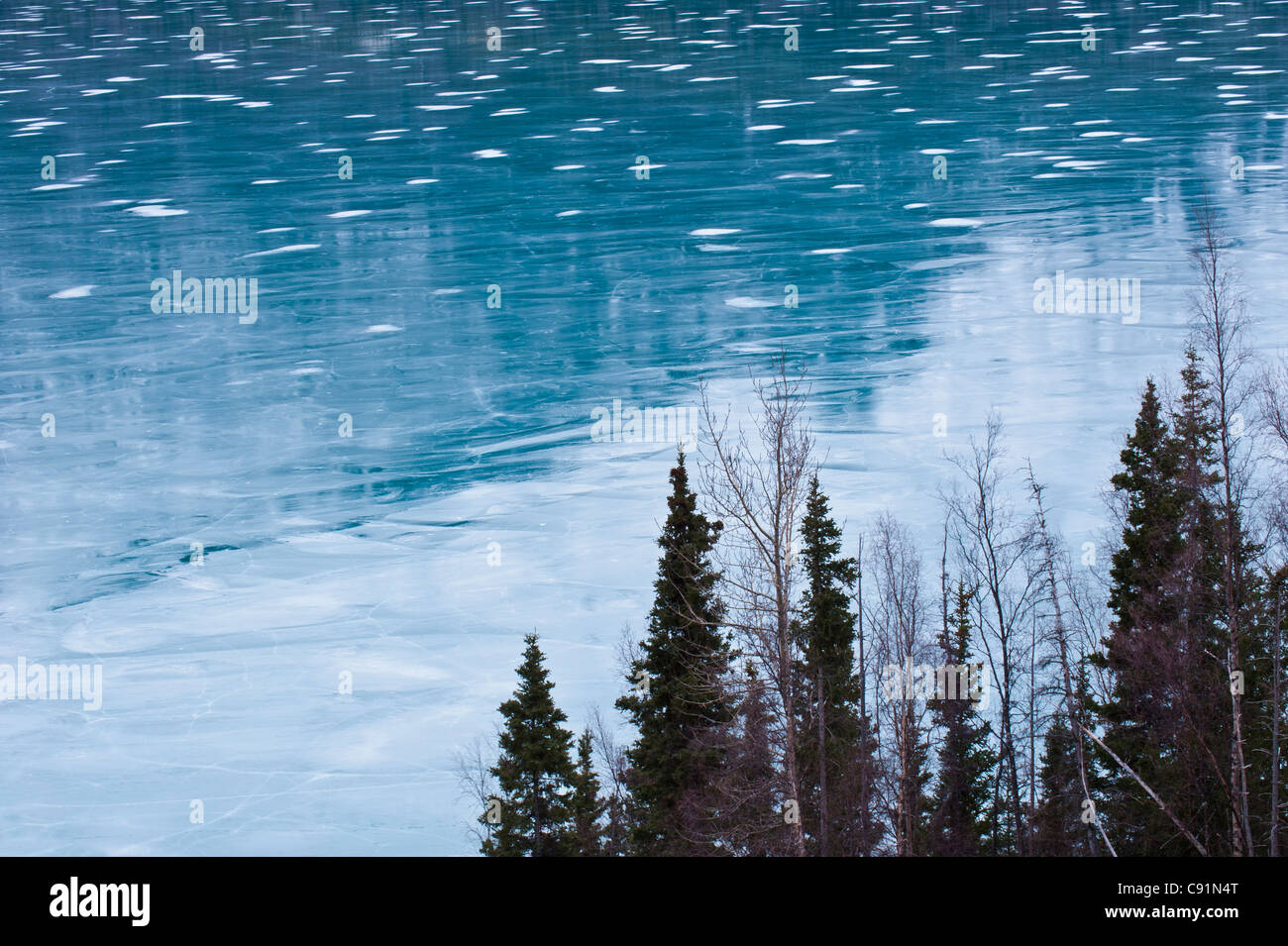 Small patches of snow on the surface of frozen Kenai Lake near Cooper Landing, Kenai Peninsula, Southcentral Alaska, Winter Stock Photo