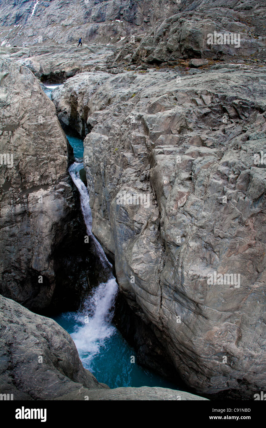 Man looking into the West Fork Eklutna River below the Eklutna