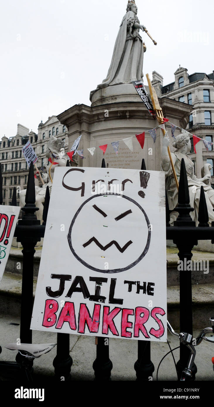 'Jail the Bankers' sign by the Queen Victoria statue St. Paul's Cathedral Occupy Movement in London October 2011  KATHY DEWITT Stock Photo