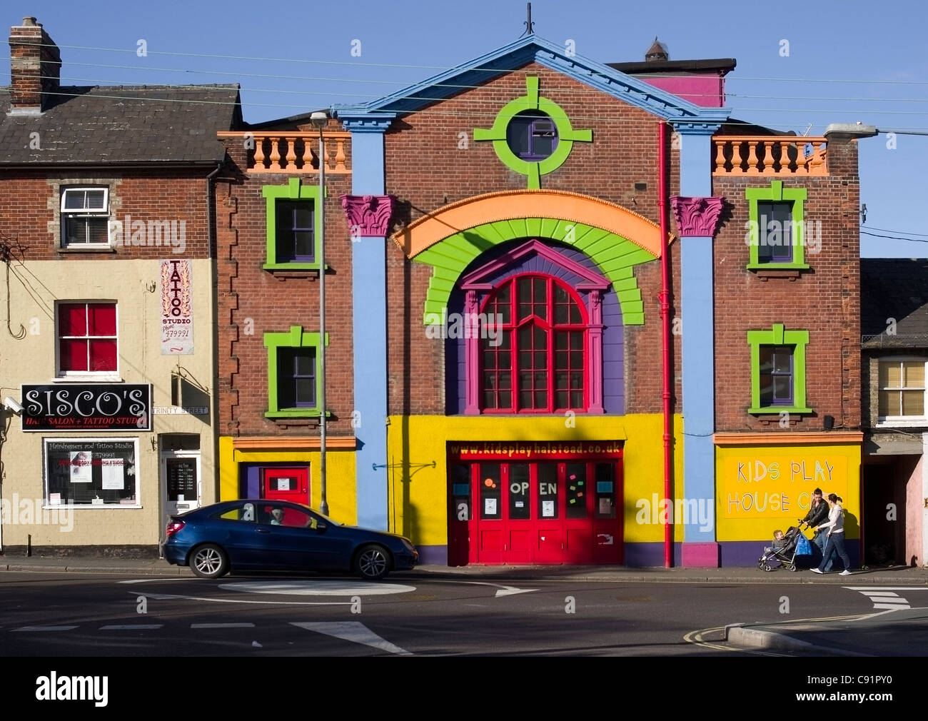 brightly painted former cinema THE SAVOY in Halstead Essex now used as a playgroup and kids party centre Stock Photo