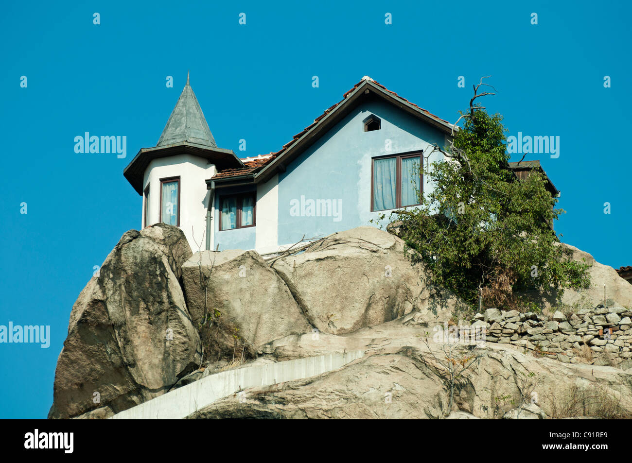House on top of the mountain on a rocks Stock Photo