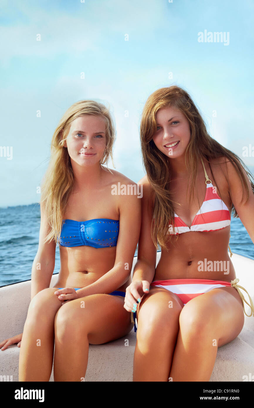 Teenage girls relaxing on sailboat Stock Photo - Alamy