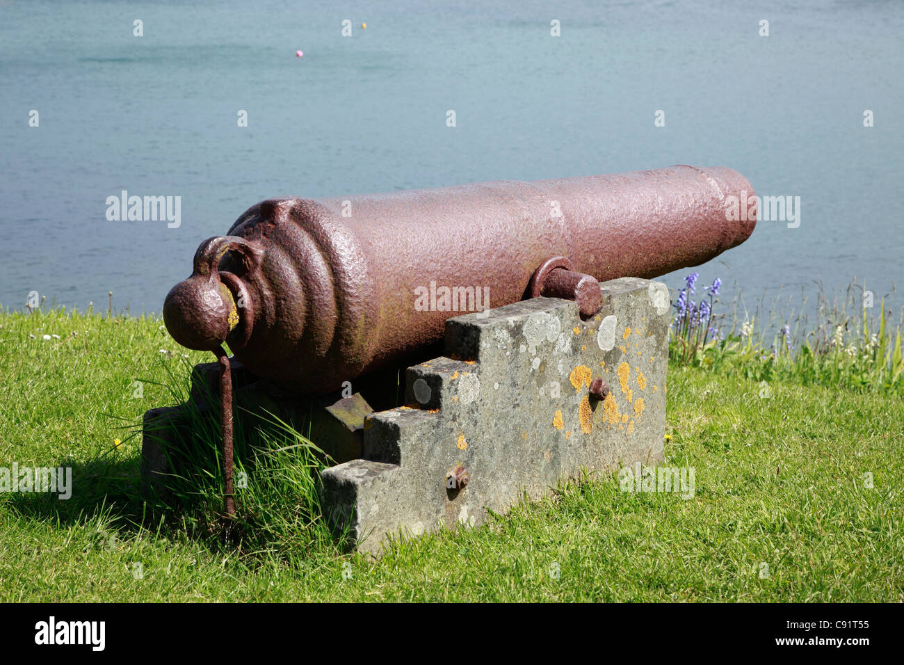 An old gun guarding the harbour at Stromness, the second largest town on Orkney,Scotland. Stock Photo
