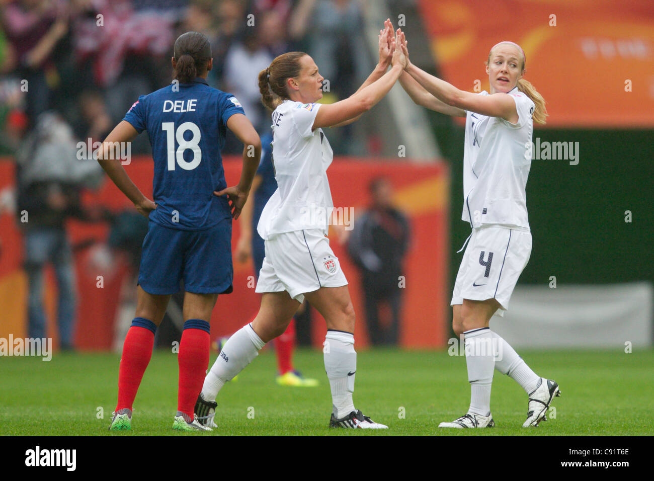 USA team captain Christie Rampone (L) and teammate Becky Sauerbrunn  celebrate after a goal against France in a World Cup match. Stock Photo