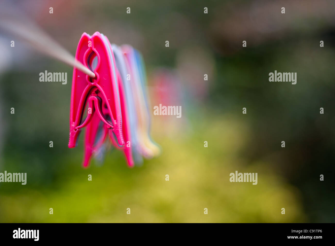 Pegs hanging on a washing line, a close up narrow focus shot using a low aperture Stock Photo