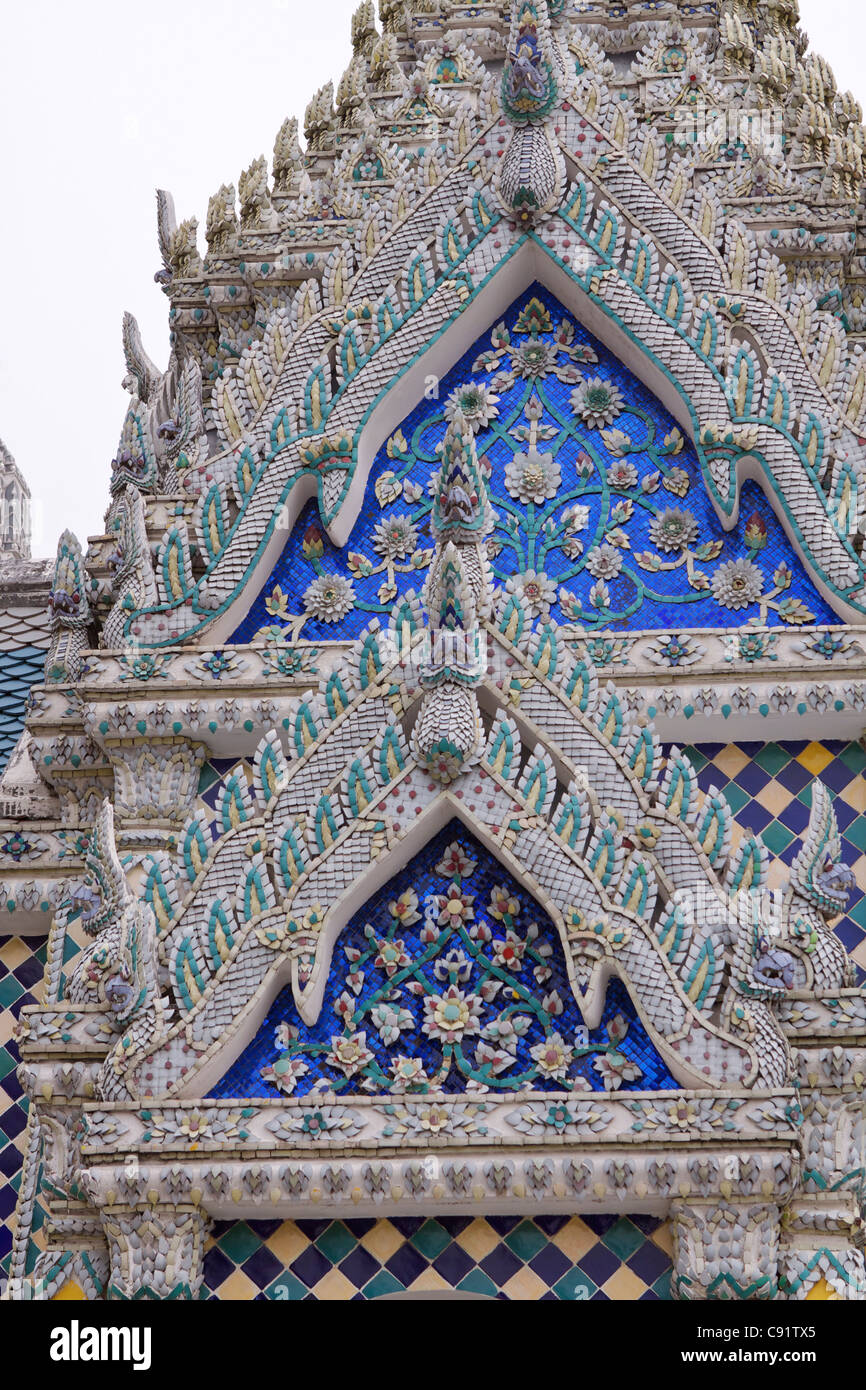 Ornate ceramic mosaic facade of a temple within the Royal Palace or Grand Palace complex in Rattanakosin the old city in Stock Photo