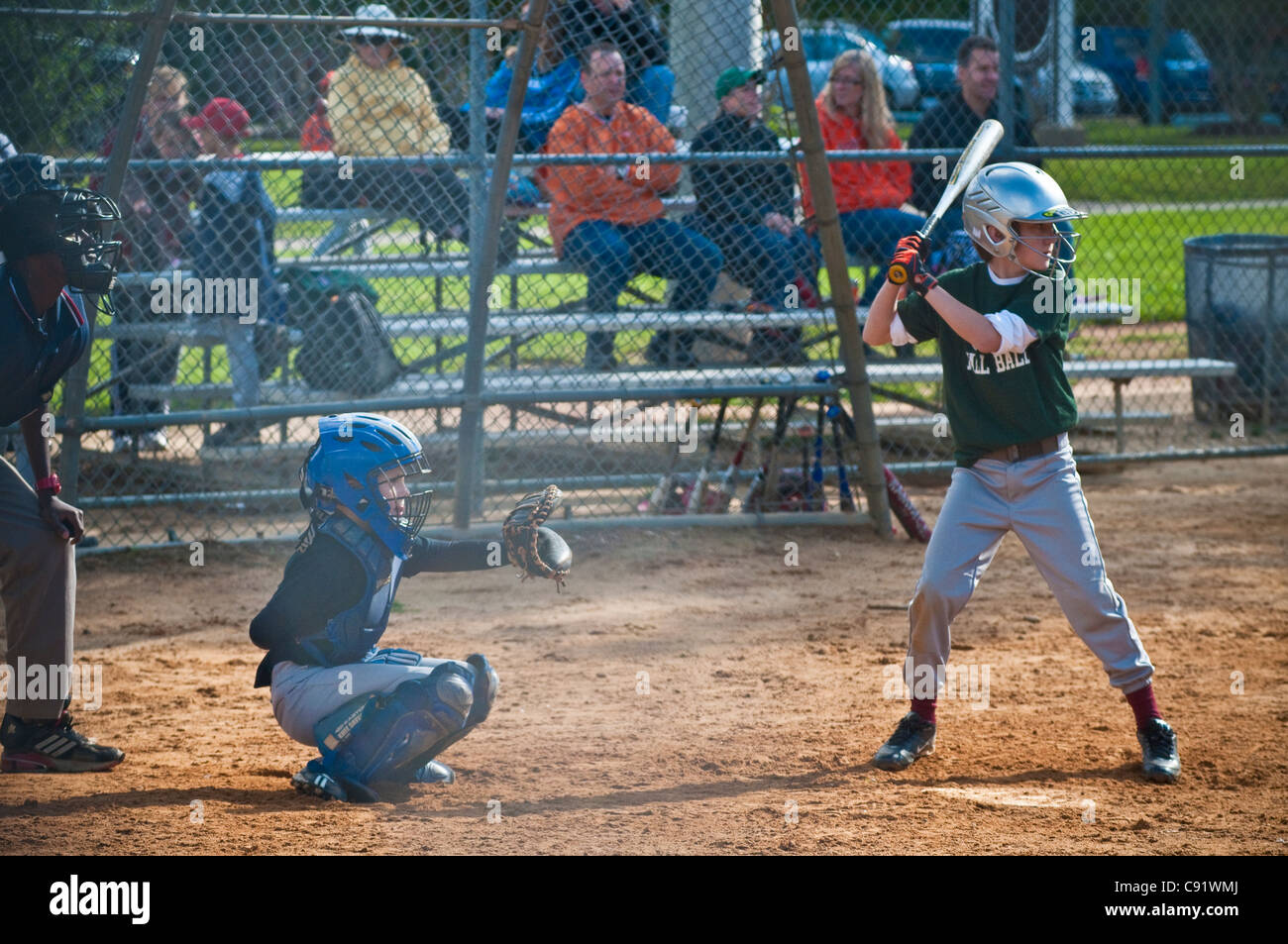 boy at bat w/ catcher and fans Stock Photo Alamy