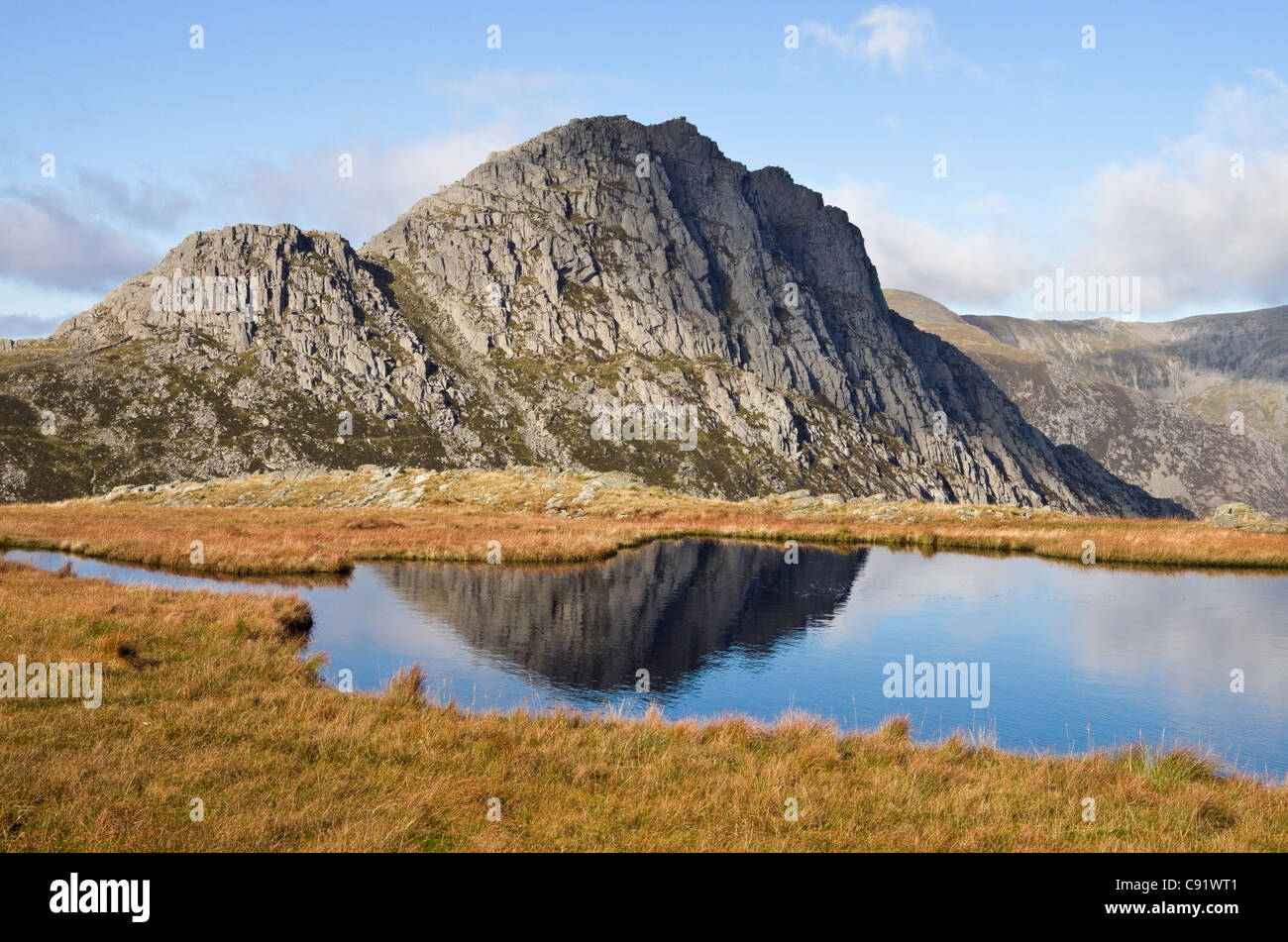 View across Llyn Y Caseg-fraith lake to mount Tryfan mountain peak summit in Snowdonia National Park. North Wales, UK, Britain Stock Photo