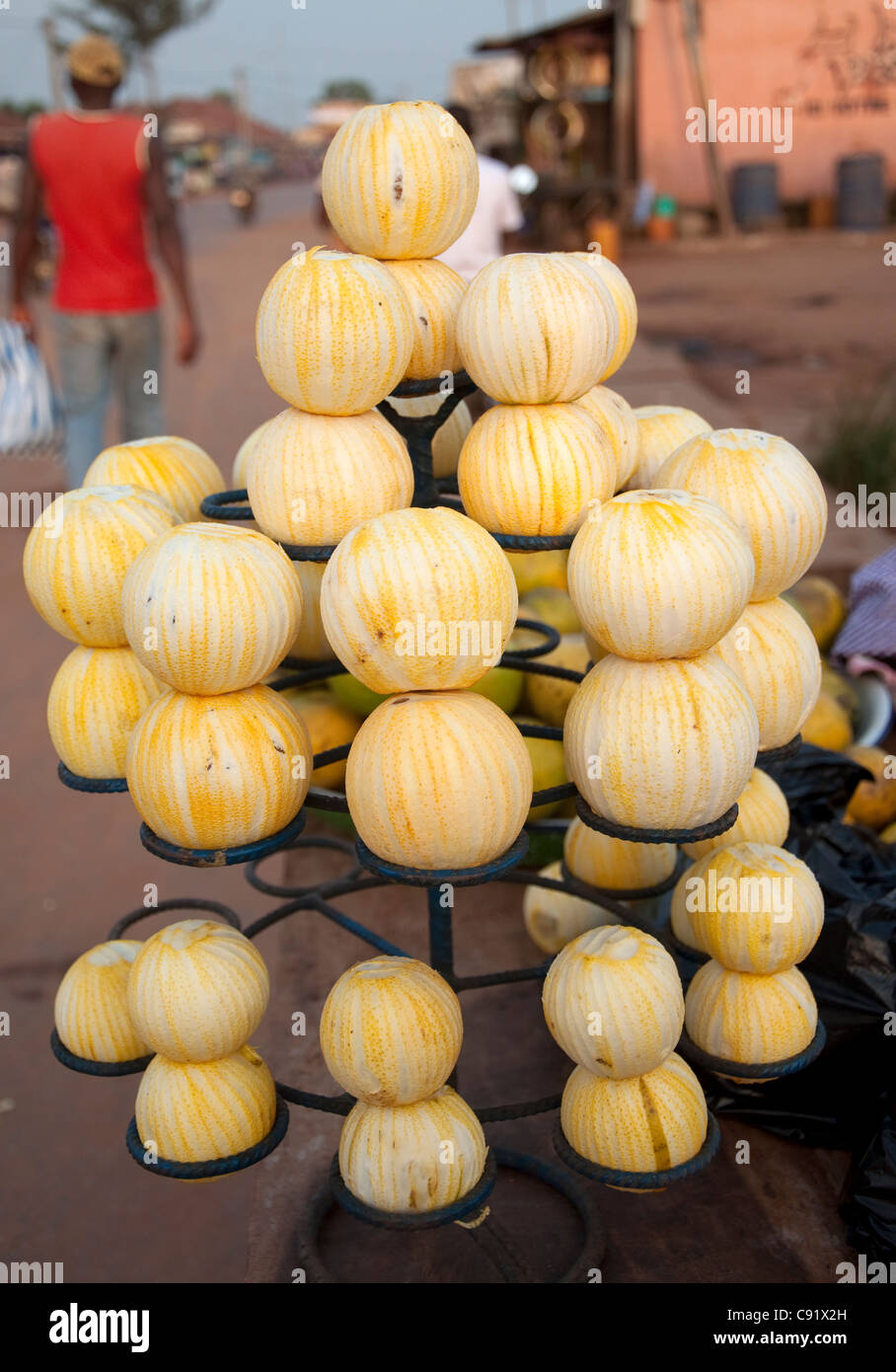 Fresh peeled oranges are often for sale in roadside stalls in towns like Azove. People buy these oranges and suck the juice out. Stock Photo