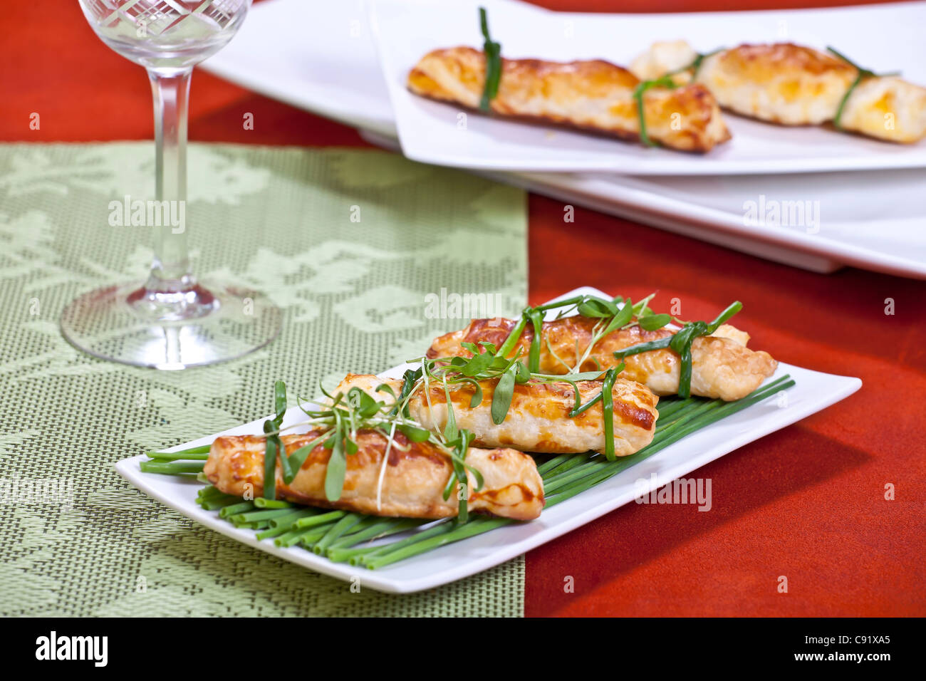 Aperitif with puff candy, stuffed with cream cheese and Swiss mountain cheese  Stock Photo