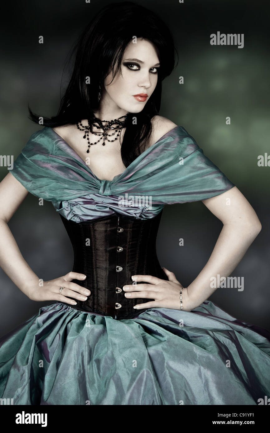 young adult female in taffeta dress with corset Stock Photo