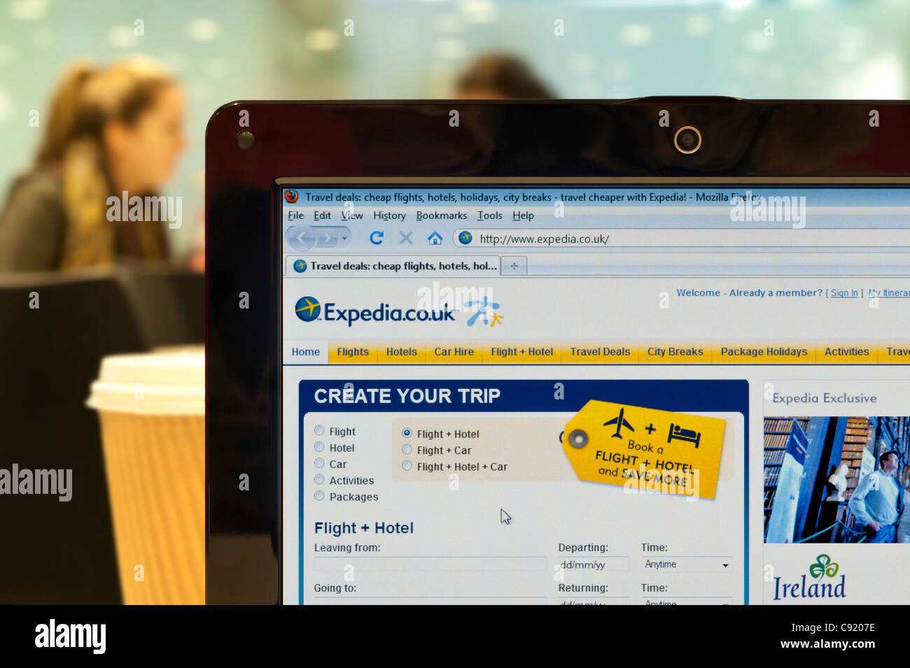 The Expedia website shot in a coffee shop environment (Editorial use only: print, TV, e-book and editorial website). Stock Photo