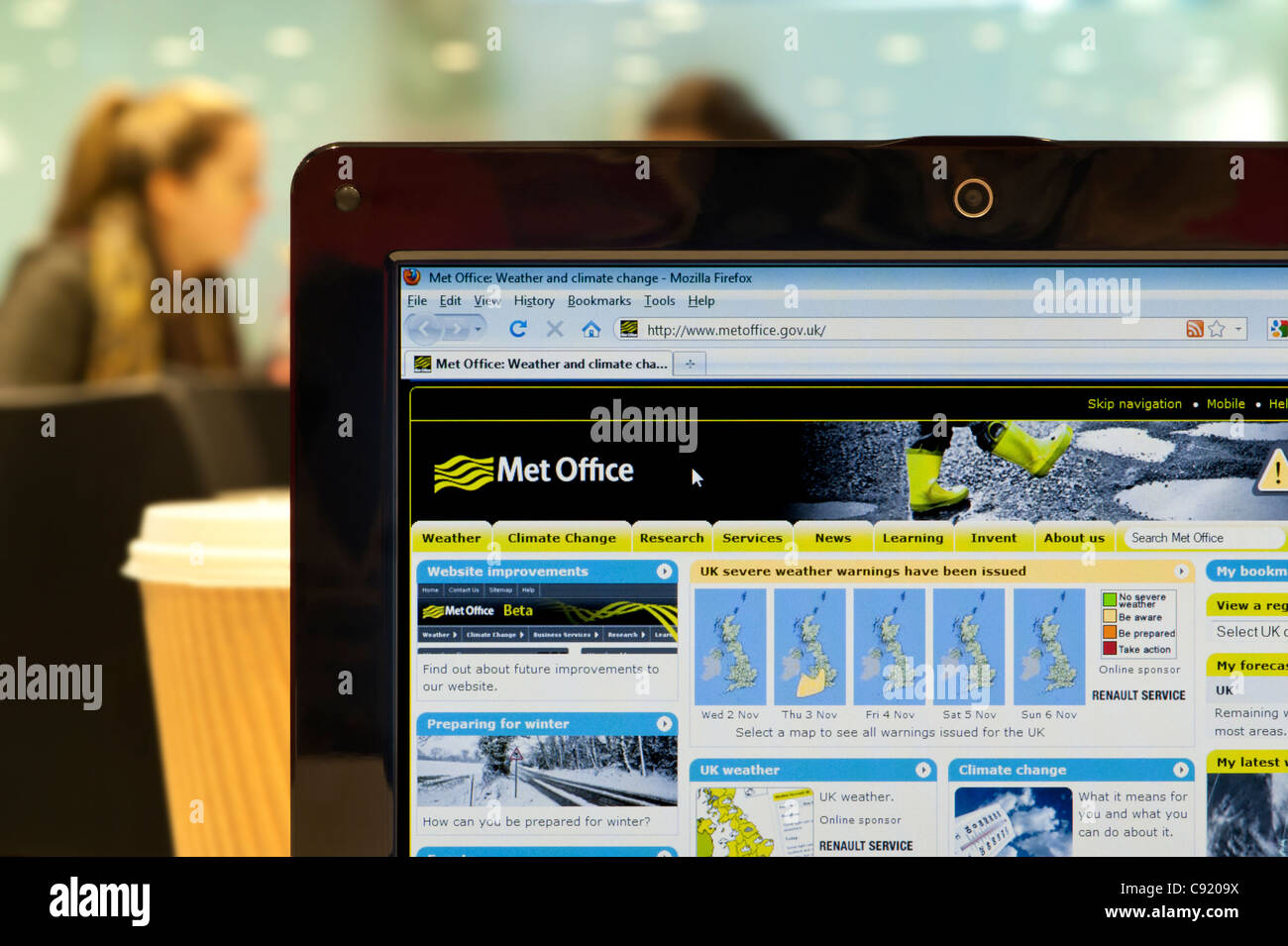 The Met Office website shot in a coffee shop environment (Editorial use only: print, TV, e-book and editorial website). Stock Photo