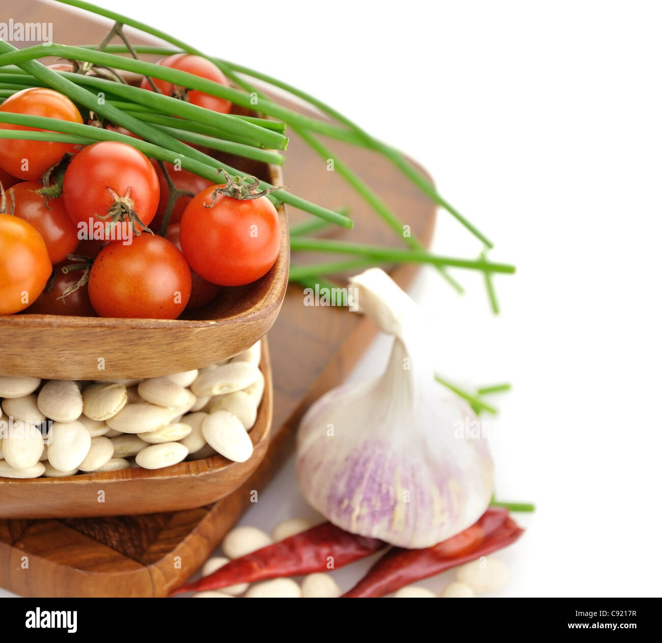 Baby Lima Beans , Tomatoes And Spices In Wooden Bowls Stock Photo