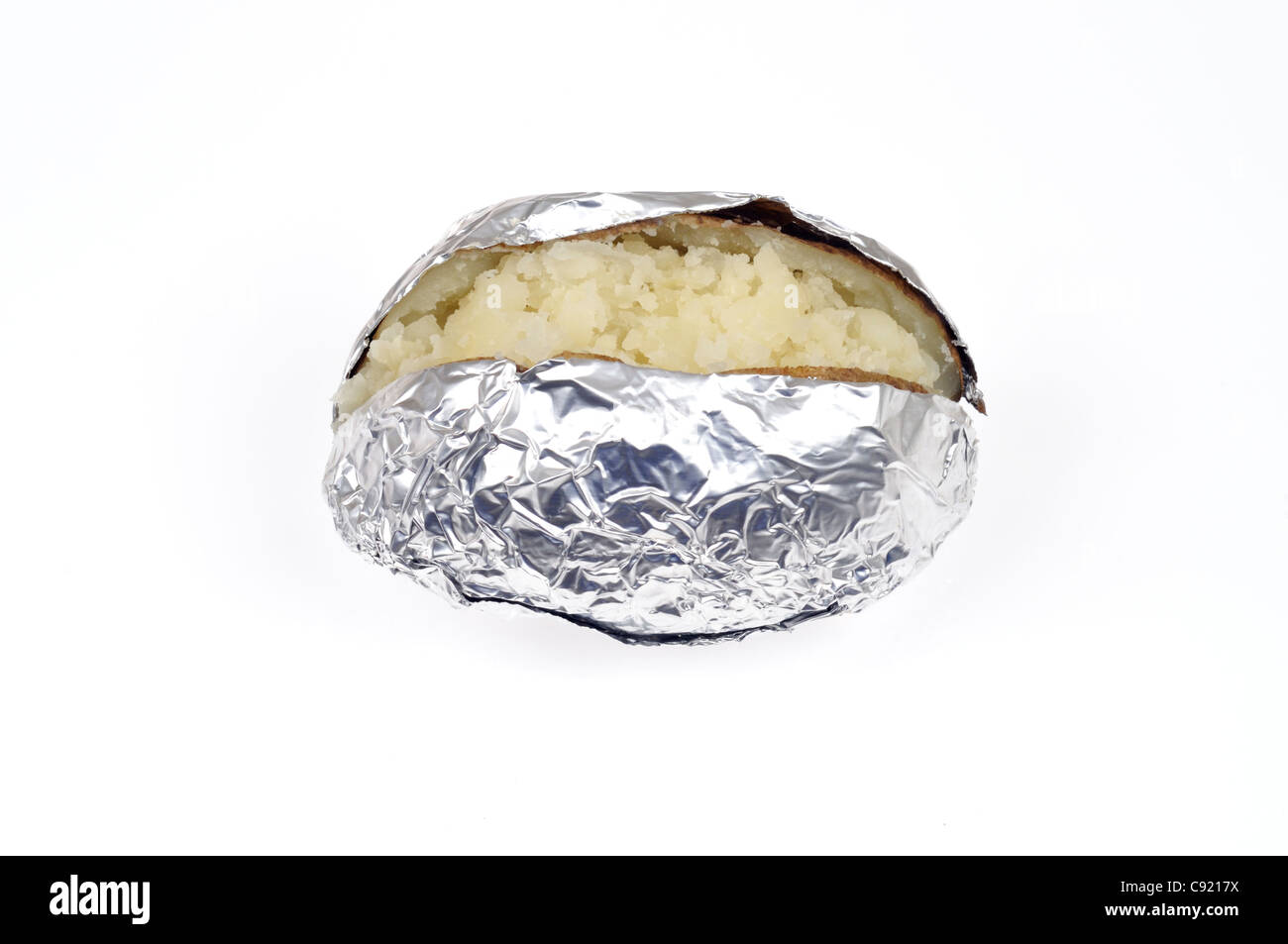 Cooked plain baked jacket potato wrapped aluminum foil on white background cutout. Stock Photo