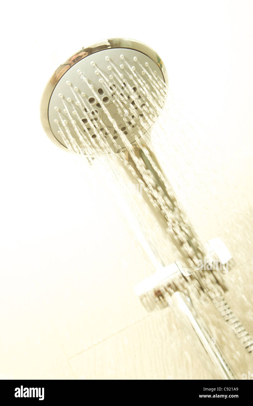 A hotel shower head flowing with water Stock Photo Alamy