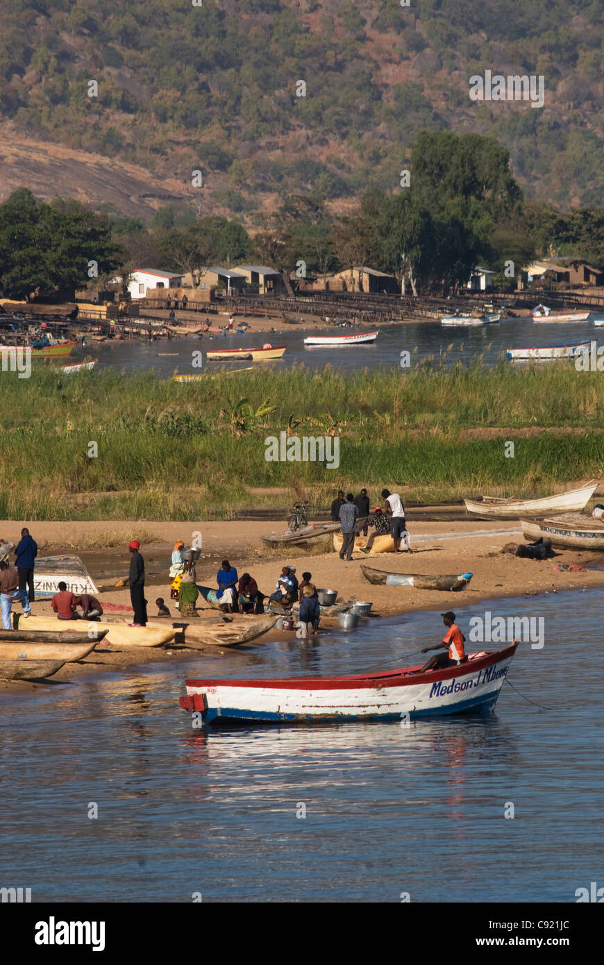 Malawian fishing villages stand on the Cape Maclear shoreline at the southern end of Lake Malawi. Stock Photo