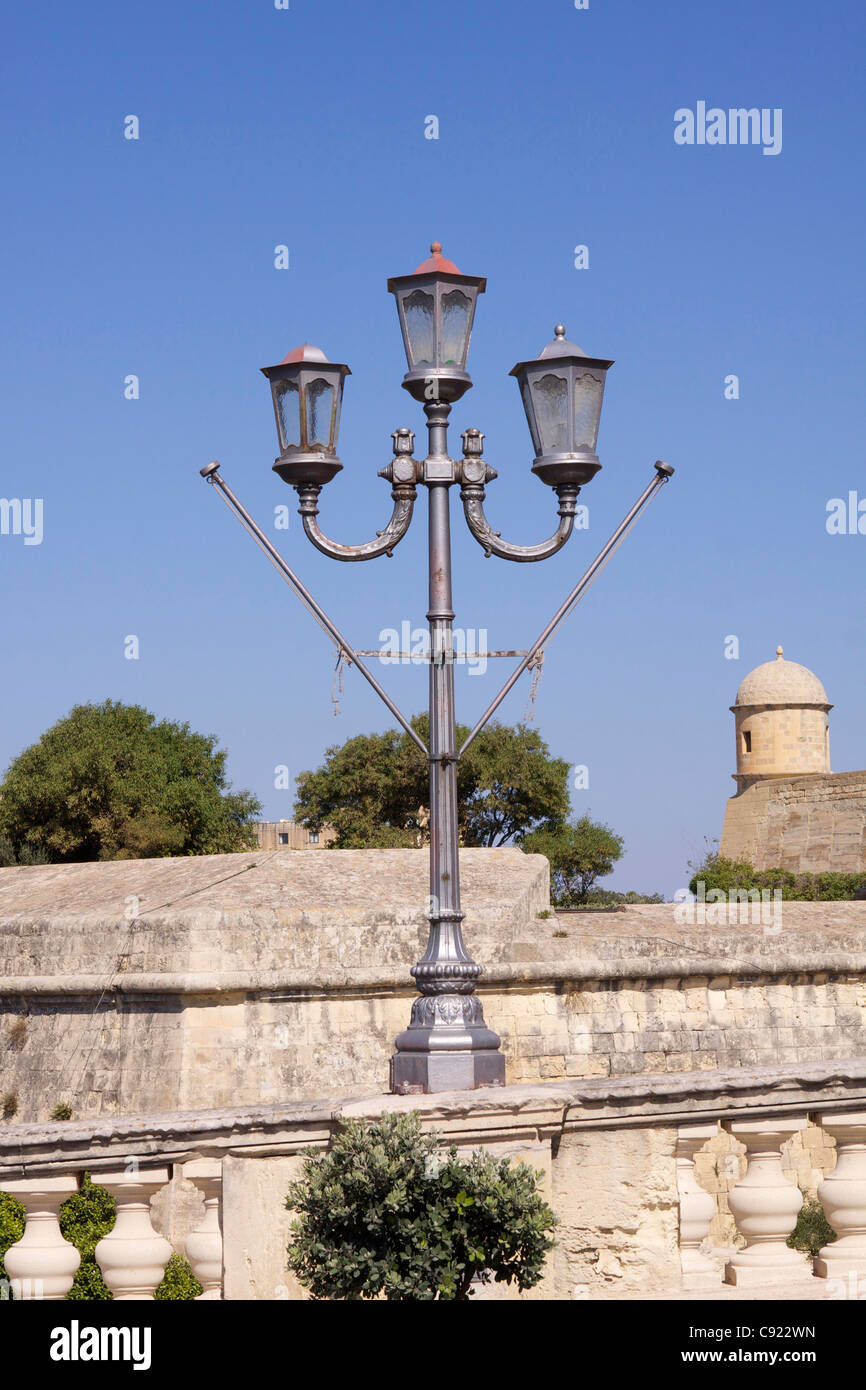 Wrought iron street lamps in the Upper Barracca Gardens in Valletta. Stock Photo
