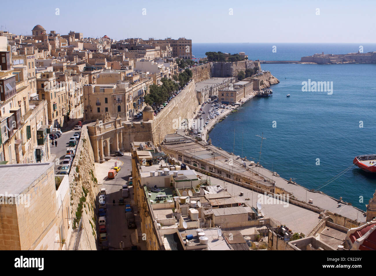 View over the Barriera wharf and the Victoria Gate in Valletta looking towards the entrance from the Mediterranean sea to the Stock Photo
