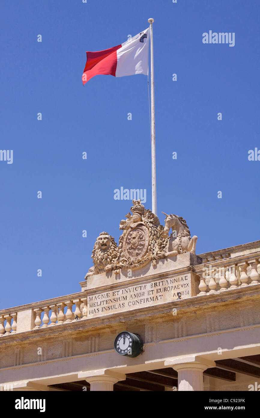 The Maltese flag flying on top of a Government building with the Maltese flag flying on St George's Square Misrah San George or Stock Photo