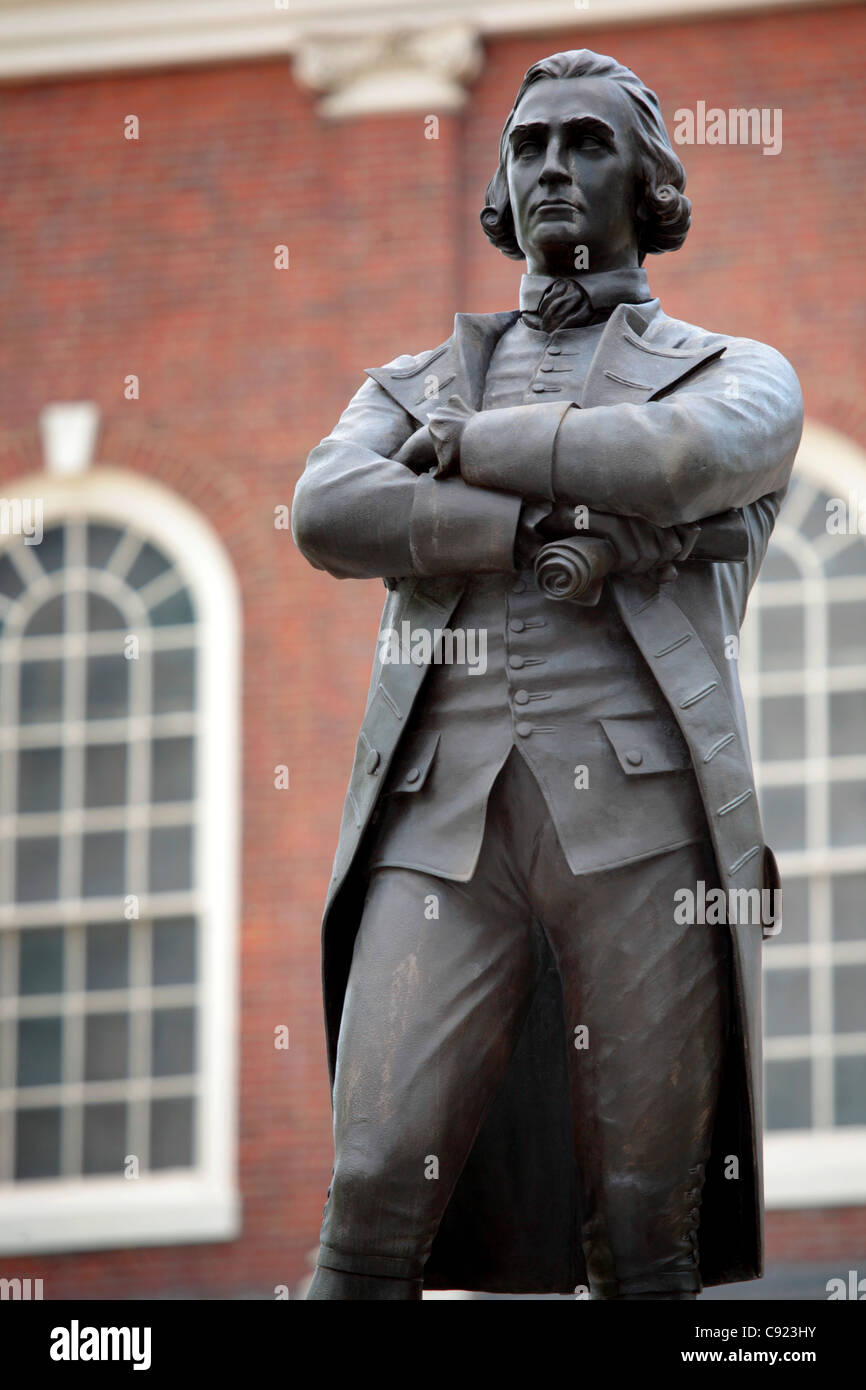 A statue of Samuel Adams statesman and Founding Father stands in front of Faneuil Hall where the Boston Town Meeting was held. Stock Photo