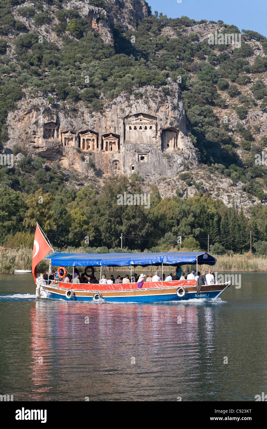 Tourboat in front of the Lycian tombs at The Dalyan River in Turkey Stock Photo