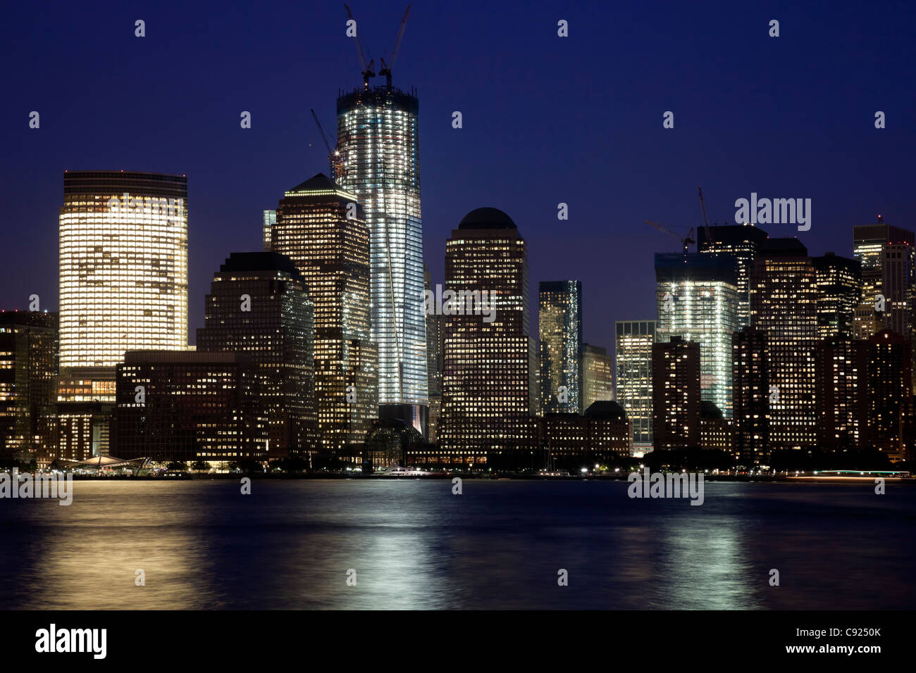 The New York City skyline at twilight w the Freedom tower Stock Photo ...