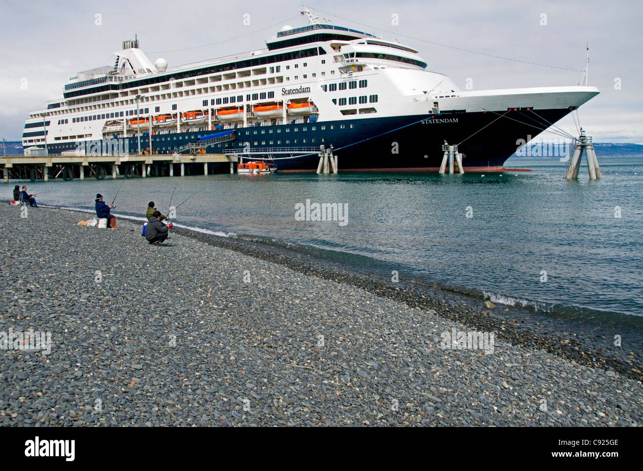 A Cruise Ship Docked On The Homer Spit Towering Over Sport Fishermen On The Beach Of Kachemak Bay Homer Spit Alaska Spring Stock Photo Alamy