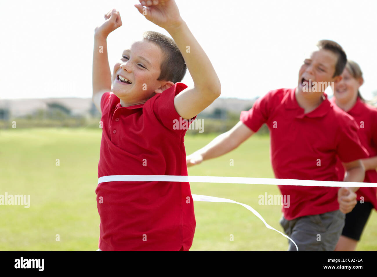 Boy crossing finish line race hi res stock photography and images Alamy
