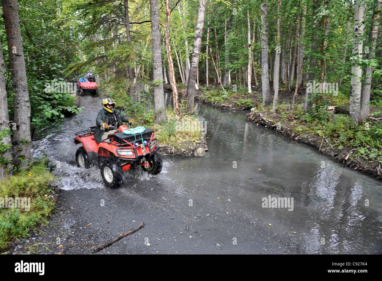 Riders on an ATV tour to the Knik Glacier in the Matanuska Valley with Alaska Backcountry Adventure Tours near Palmer, Alaska Stock Photo