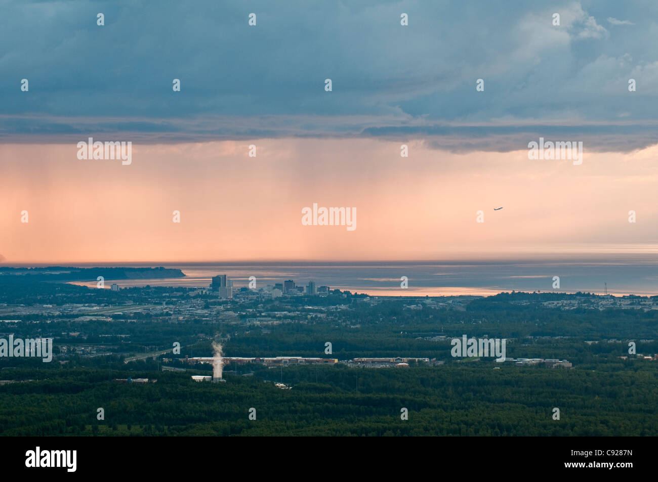 Aerial view of downtown Anchorage in a late summer evening with a rainstorm in the background, Alaska Stock Photo