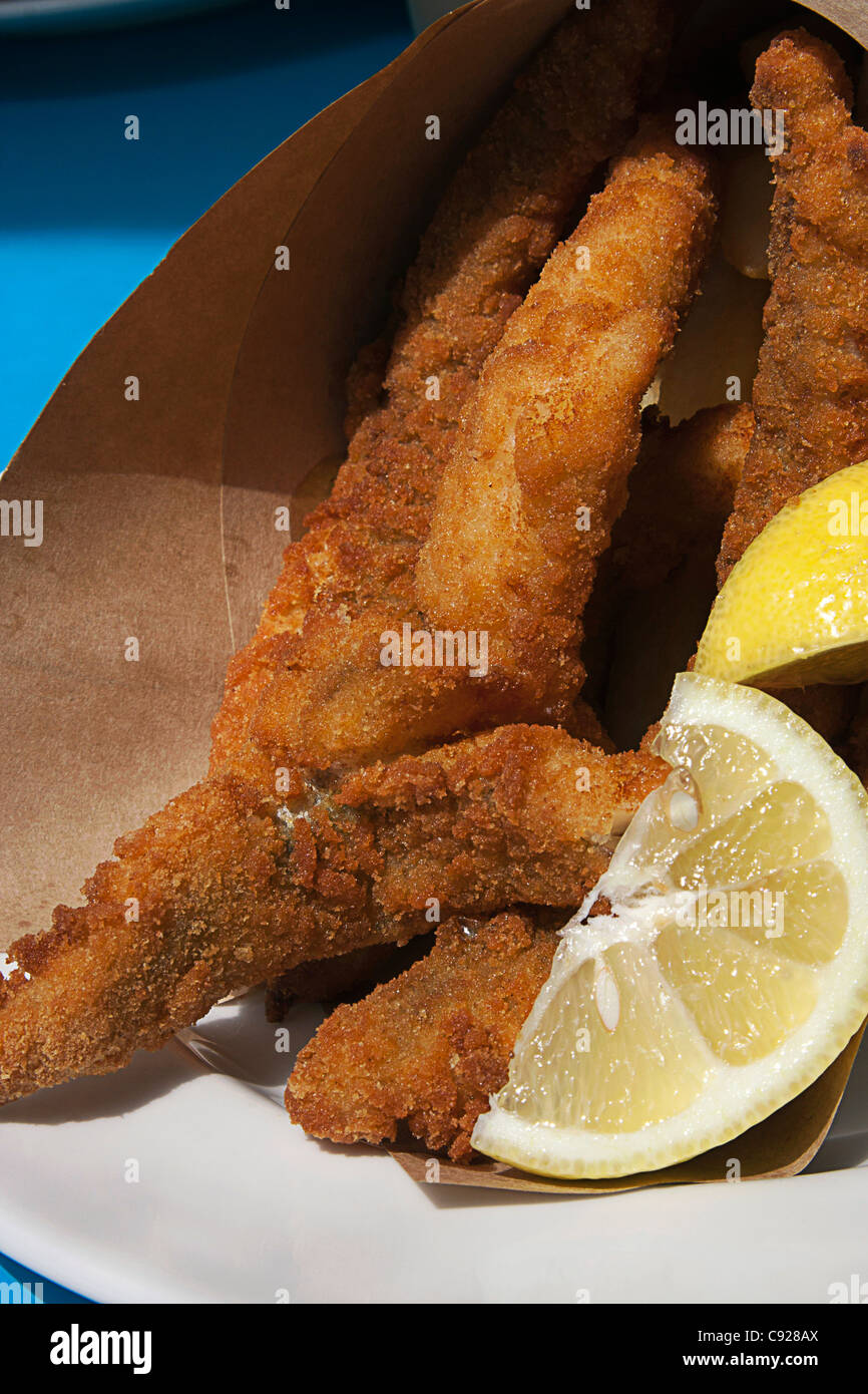Australia, Tasmania, Hobart, Franklin Wharf, fish and chips wrapped in brown paper Stock Photo