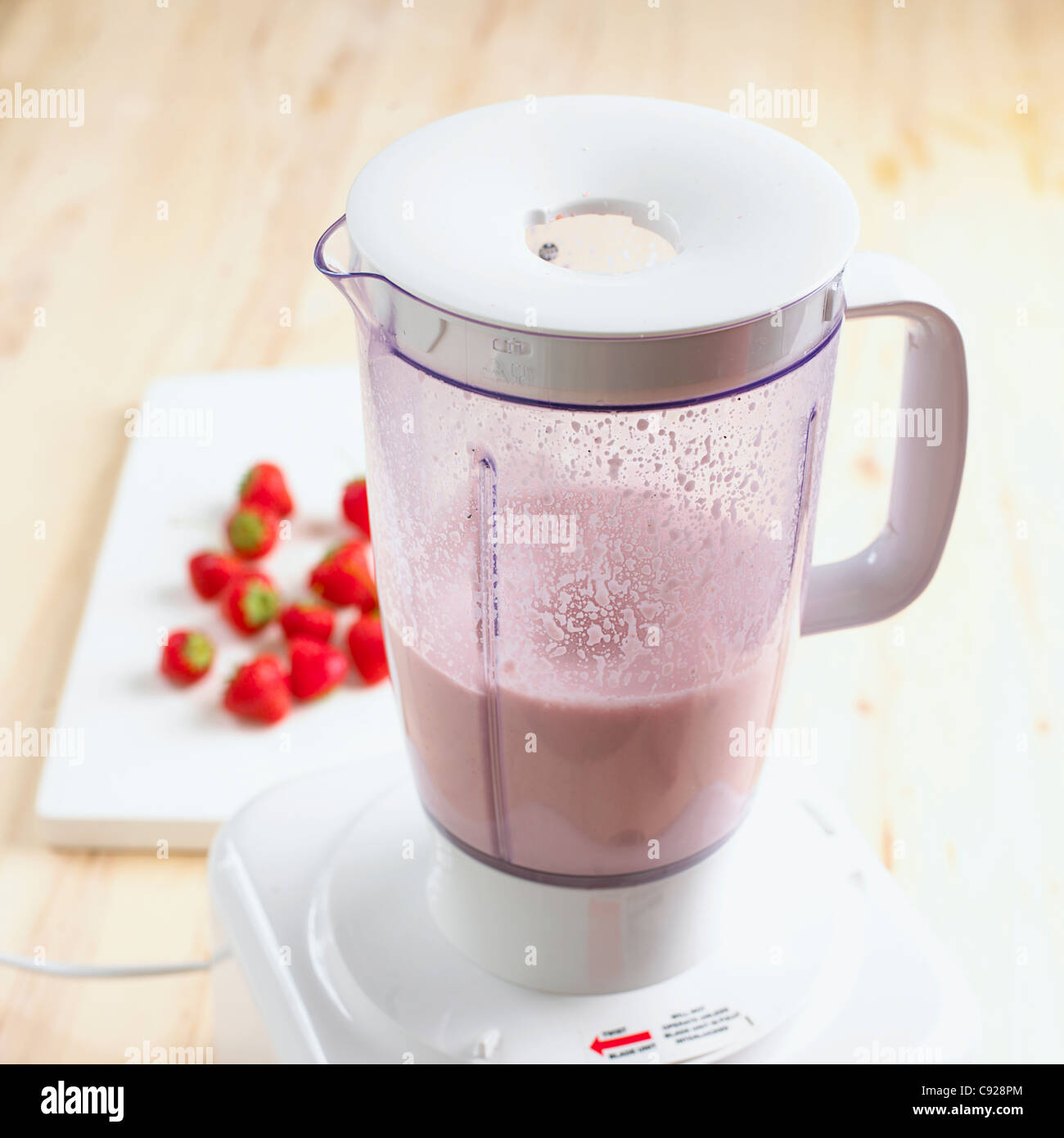 Strawberry smoothie in blender Stock Photo