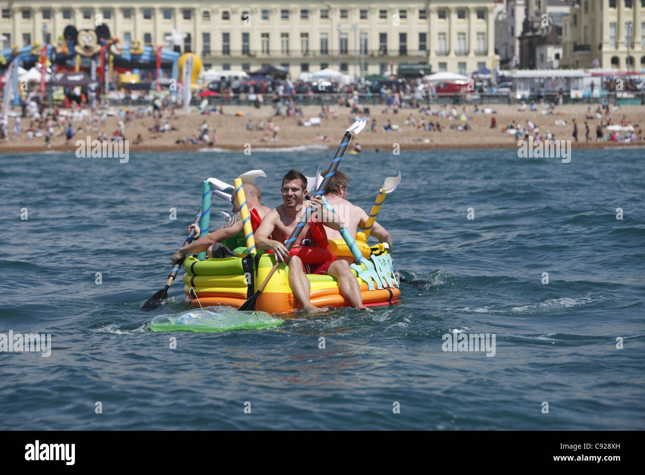 The quirky annual Paddle Something Unusual Round The Pier, held on a weekend in July in Brighton and Hove, East Sussex, England Stock Photo