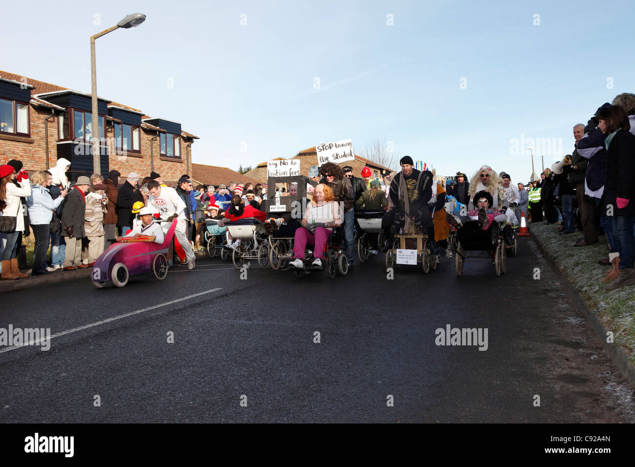 The quirky annual Pagham Pram Race, held annualy on Boxing Day, 26th Dec, in the village of Pagham, West Sussex, England Stock Photo