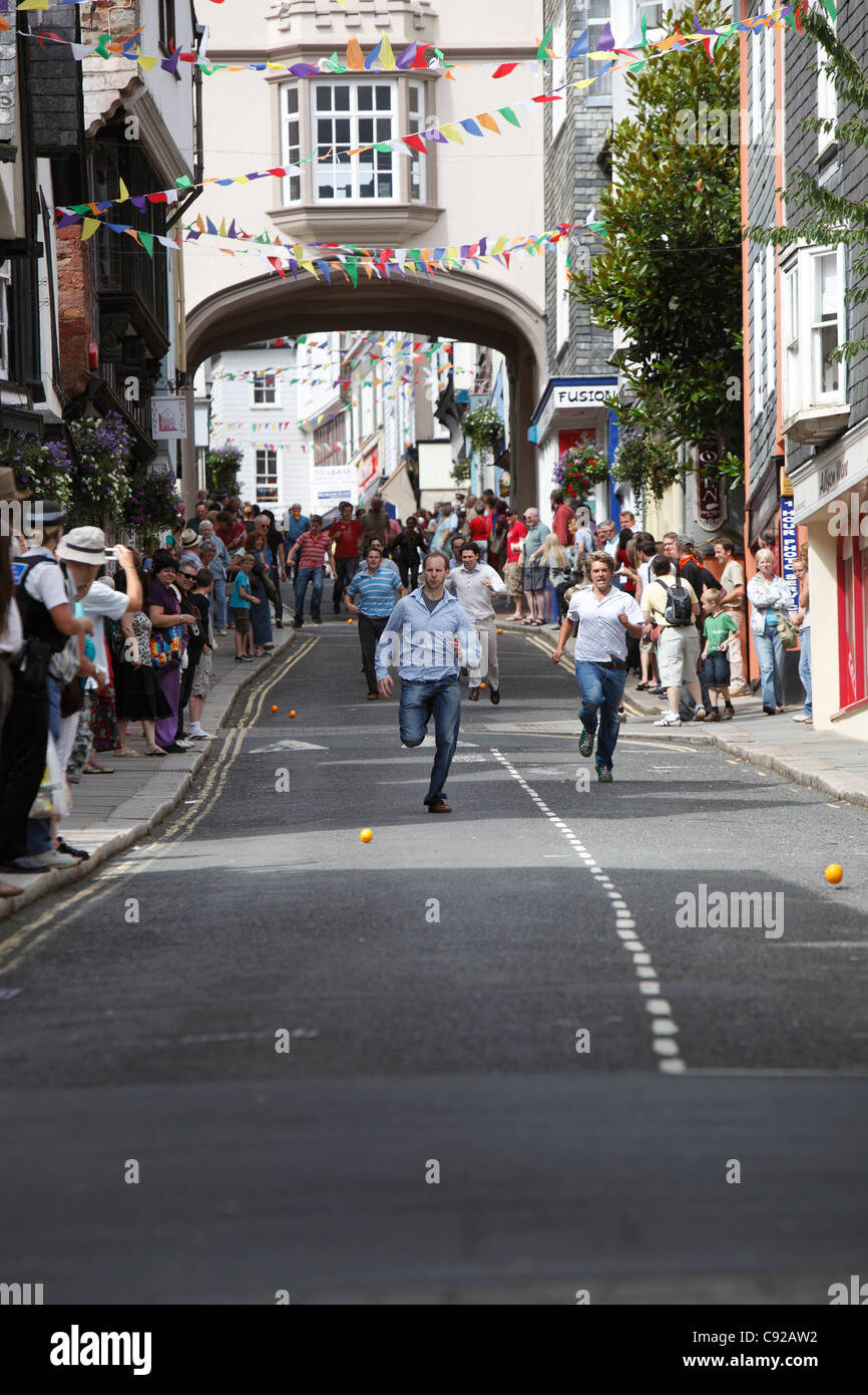 The quirky annual Totnes Orange Races, held on a Summer weekday morning on the High Street in Totnes, Devon, Englan Stock Photo