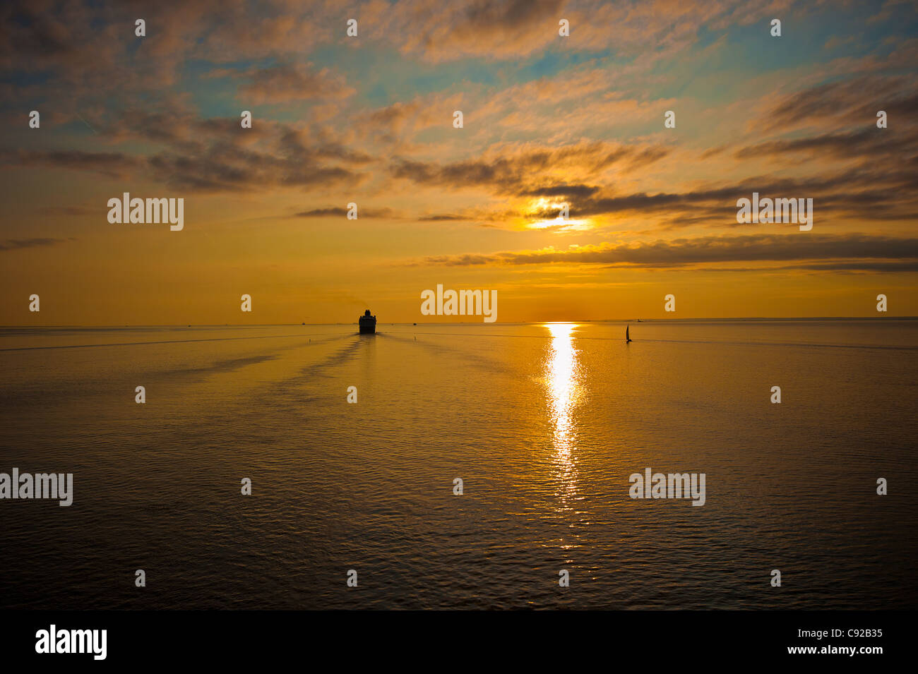 cruise liner in the sea at sunset Stock Photo - Alamy