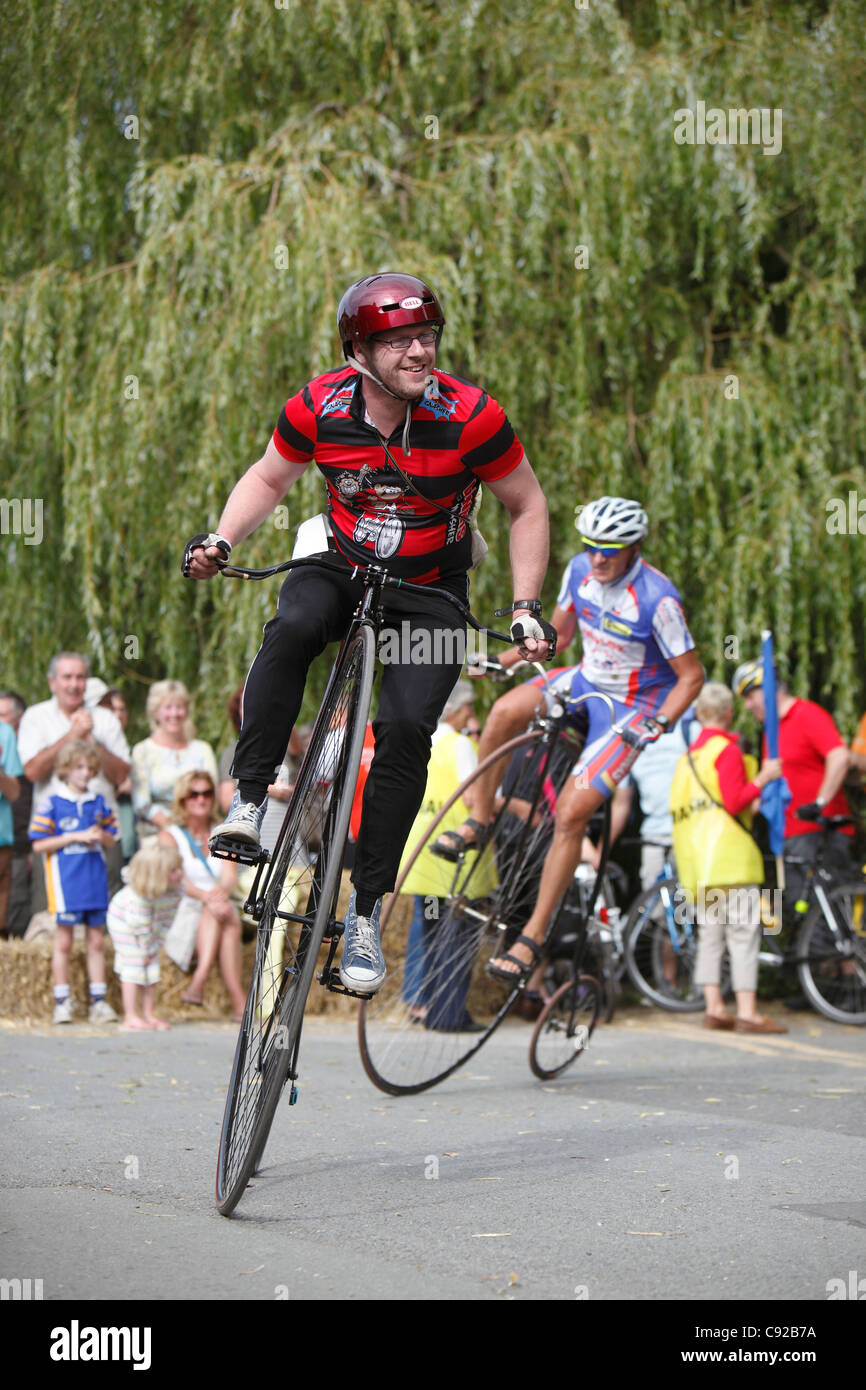 Knutsford Great Race held once every ten years. Penny Farthing Cycles race for three hours around Knutsford, Cheshire, England Stock Photo